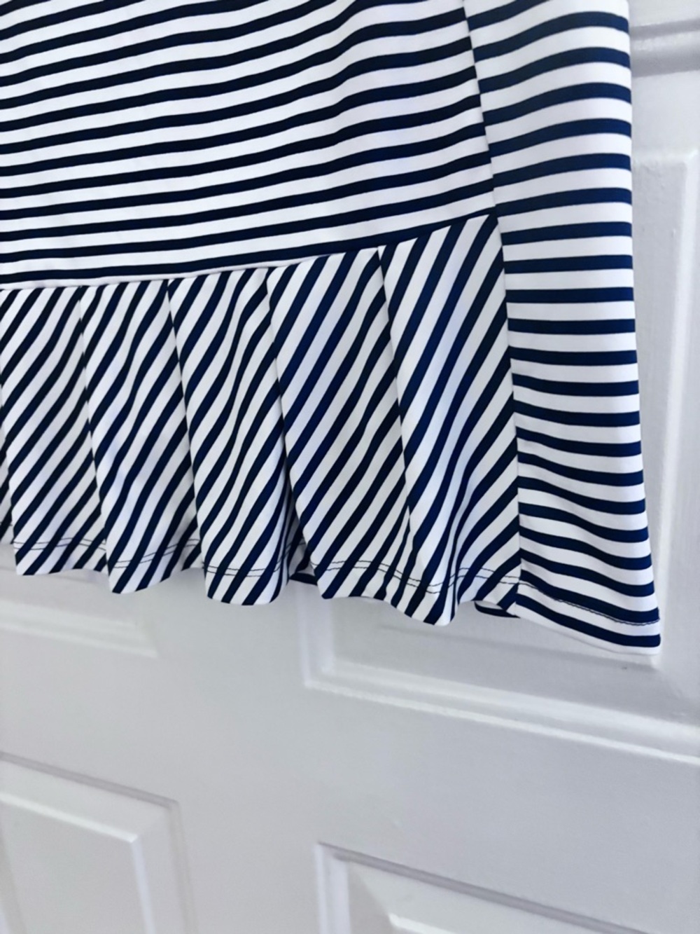 Izod Navy and White Striped Golf Skort with Pleated Flounce - Picture 4 of 6